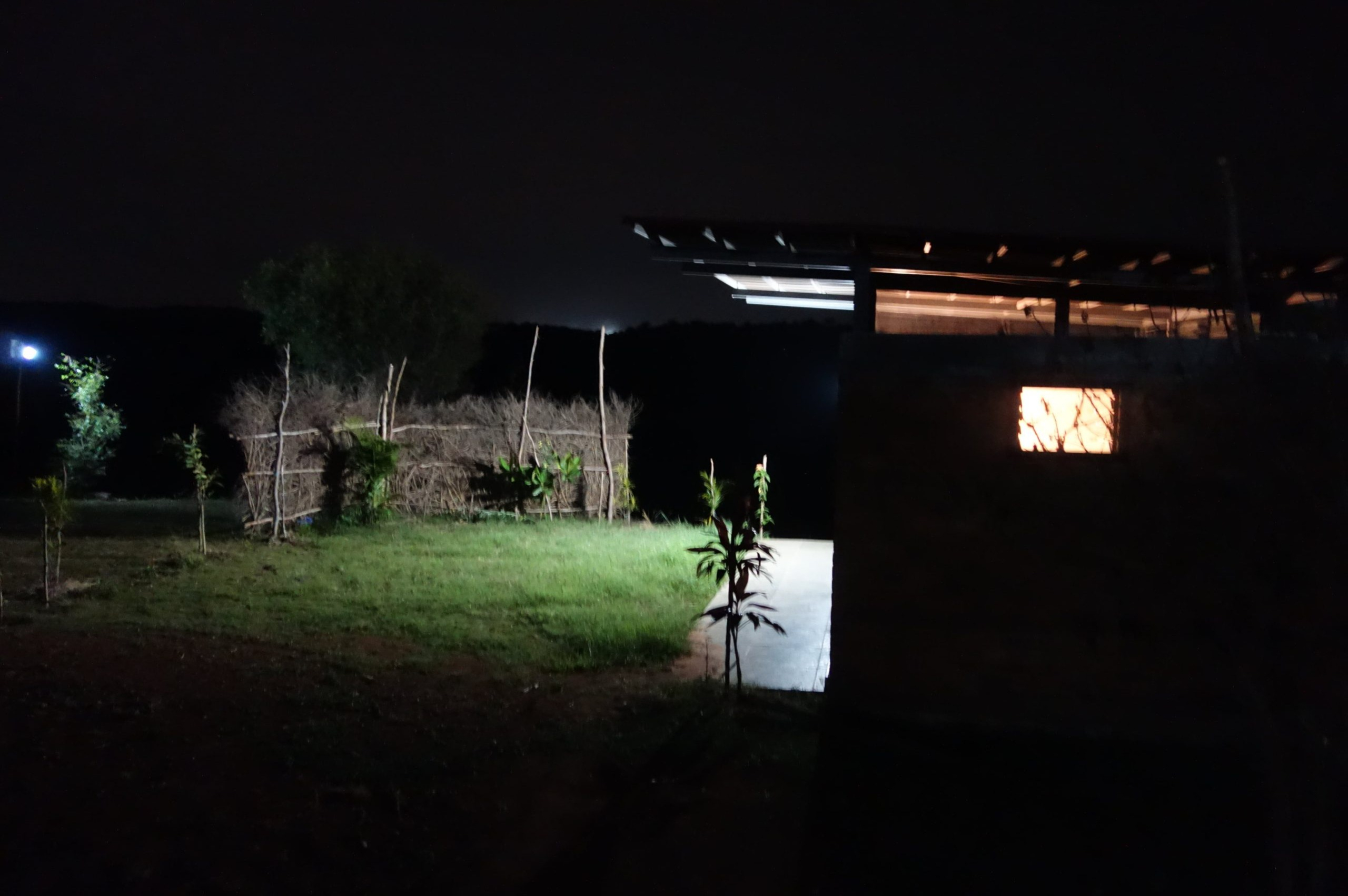 Cottages at night in Ecoland Farmstay near bengaluru